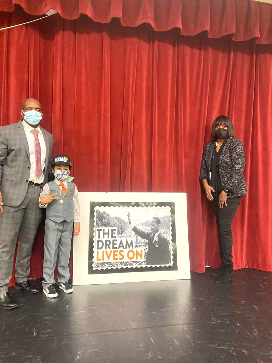 Second place winner King Green with Rosenwald Elementary Principal Bruce Hightower (left) and Marsha Andrews (right).